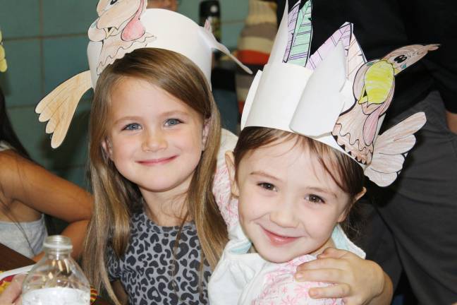 First graders throw Thanksgiving feast Madelyn O’Connor and Emma Shurter are two cute turkeys! (Photo provided)
