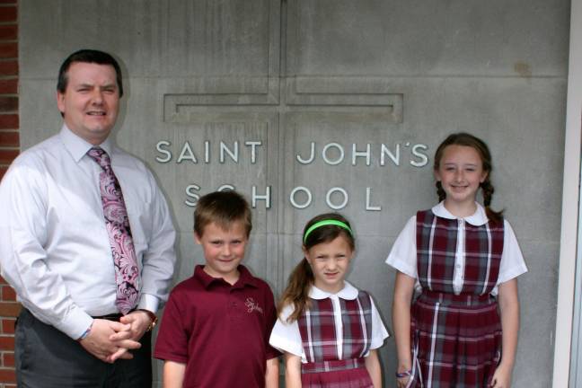 St. John's School welcomes new principal Michael O'Kane with Ryan Shust, Olivia Giordan, and Carly Larsen