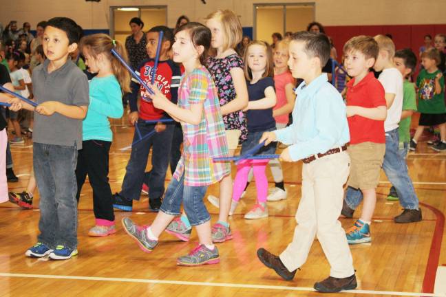 Smiles, giggles at Kindergarten Festival Tony Paulino, Jillian Healy and Michael Pagliocca nail their choreography.