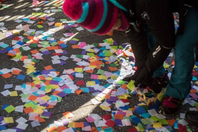 confetti practice makes perfect Children picked up fallen confetti from the ground