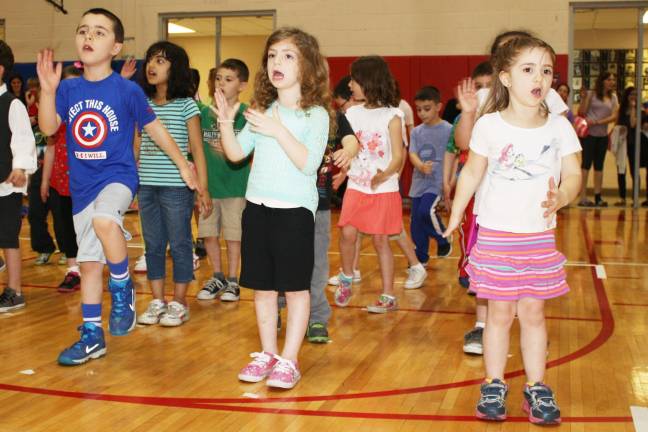Smiles, giggles at Kindergarten Festival Jake Giordano, Julianna Bonito and Emma Nelson.