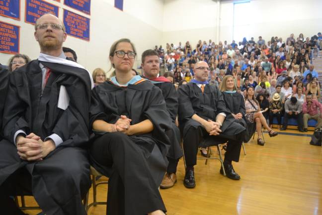 Chester Academy faculty watch as their students graduate.
