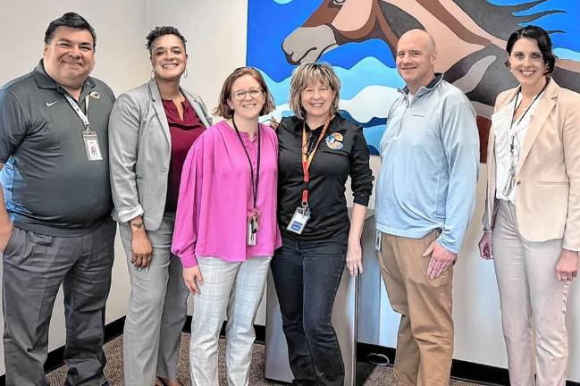 Chester Academy special education teacher honored Chester Academy teaching staff celebrate Amy Reid (center, in black), for her award win.