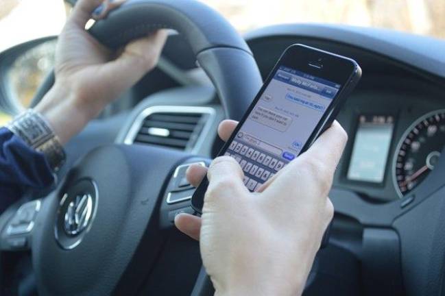 Tighter ‘texting while driving’ laws could spell trouble for phone-addicted motorists Tighter ‘texting while driving’ laws could spell trouble for phone-addicted motorists
