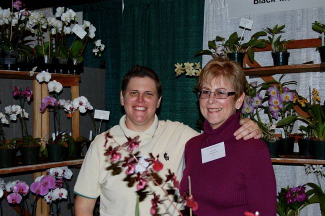 The focus is orchids at Black Meadow Flora Open House Photo courtesy Black Meadow Flora Black Meadow Flora Greenhouse Operations Manager Micki Bridge left, is see here with her mother, owner and president of Black Meadow Flora, Margaret C. Bridge. They are hosting an open house this weekend.
