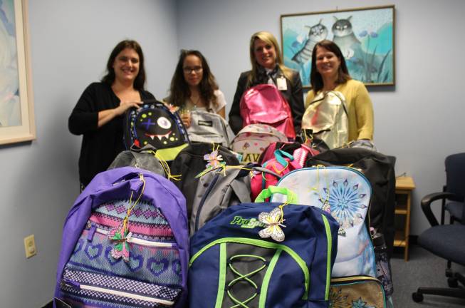 Girl Scout's butterfly bags bring hope to children in foster care Provided photo From left: Brooke Livingston, senior caseworker Department of Social Services, Amber Vitoulis, Social Services Commissioner Darcie Miller, AND Beth Van Pelt, supervisor of the department's homefinding unit.