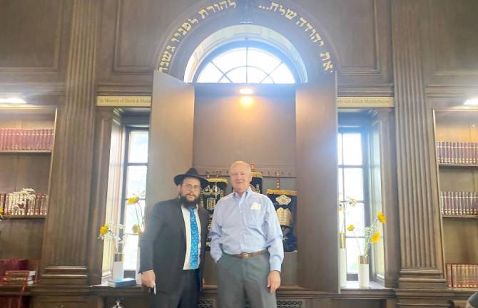 Jona Mandelbaum, from Warwick, a synagogue sponsor, with Rabbi Borenstein at the new center in Goshen .