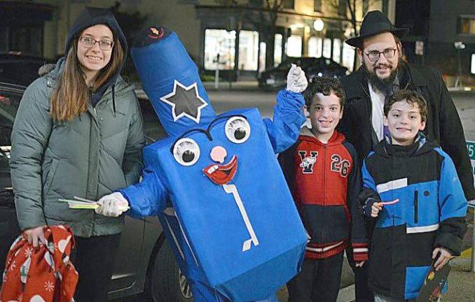 Rabbi Borenstein with The Dreidel Man and some of his friends