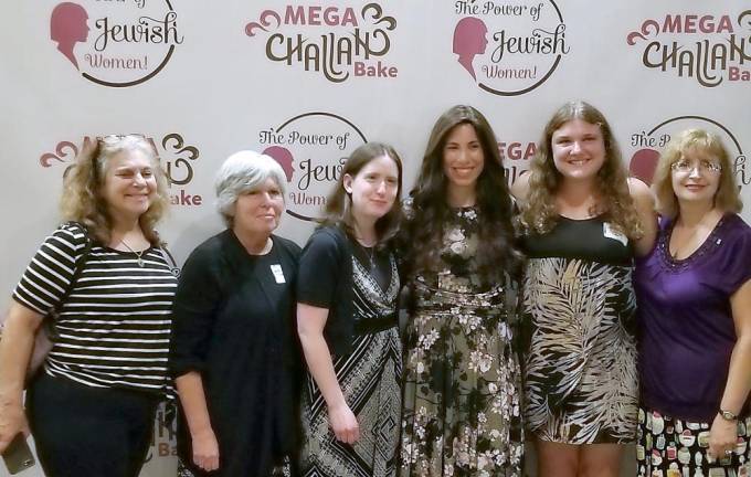 Picture from left to right at last year’s Mega Challah bake are: Anita Reich of Highland Mills, Sheryl Kerewski of Goshen, Michelle Sentell, Chana Burston, Becky Benezra and Martine Nuestadt of Monroe attend the Mega Challah Bake, led by Chana Burston.