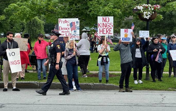 Hundreds rally in ‘No Kings Day’ protest Village Police were on hand to direct traffic and help protesters cross busy roadways near the protest in Goshen.