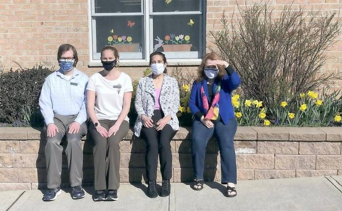 Pictured from left to right are the Chester Public Library’s Tuesday night staff: Charles Deyo, Candice Roach, Irene Dunn and Linda Rinehart. Photo by Jacob L. Mott.