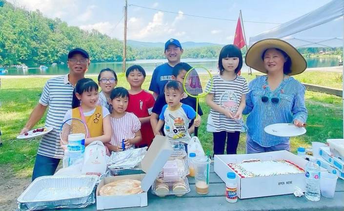 Despite‌ ‌the‌ ‌blazing‌ ‌heat,‌ ‌volunteers‌ ‌helped‌ ‌to‌ ‌set‌ ‌up‌ ‌the‌ ‌tables,‌ ‌grills and‌ ‌prepare‌ ‌food‌ ‌for‌ ‌everyone‌ ‌to‌ ‌enjoy.‌ ‌Families‌ ‌brought‌ ‌homemade‌ ‌dishes‌, ‌including‌ ‌baozi,‌ ‌kung‌ ‌pao‌ ‌chicken,‌ ‌gyoza,‌ ‌stir-fried‌ ‌noodles,‌ ‌sushi,‌ ‌pizza ‌and‌ ‌much‌ ‌more.‌ ‌