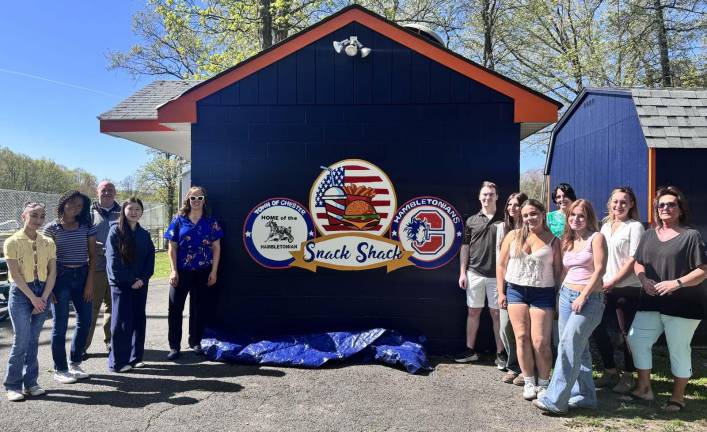 Mural painted by Chester Academy artists unveiled at Chester Commons Chester Supervisor Brandon Holdridge and Chester School administrators with artists and their teacher.