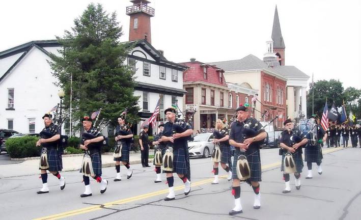 The Ancient Division of Hibernians Division 1 Pipes and Drums adding atmospheric music to the event.