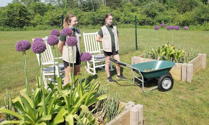 Chester Girl Scouts Abigail Ferraro and Carlie Cambria built this garden at the public library for their Silver Award project. The garden is blooming with flowers, fresh produce and herbs.