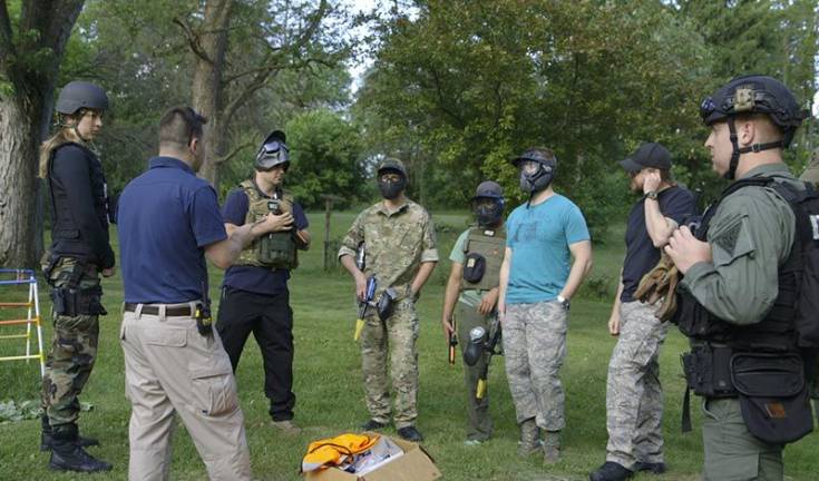 John Trentini takes flight, in medicine and in life John Trentini (second from left) trains members of SWAT teams as chief of a resident tactical group (Photo: http://medicineandthemilitary.com)