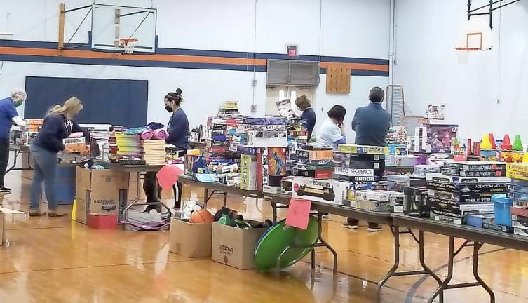 Kiwanis Club of Chester members getting toys ready to pack in the Santa Sacks on Saturday. Photos provided by Susan Bahren.