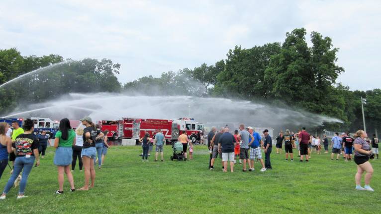 Chester Fire Department makes a splash with its new fleet Some of the onlookers at the edges got a little wet, but were glad for it on a humid day.