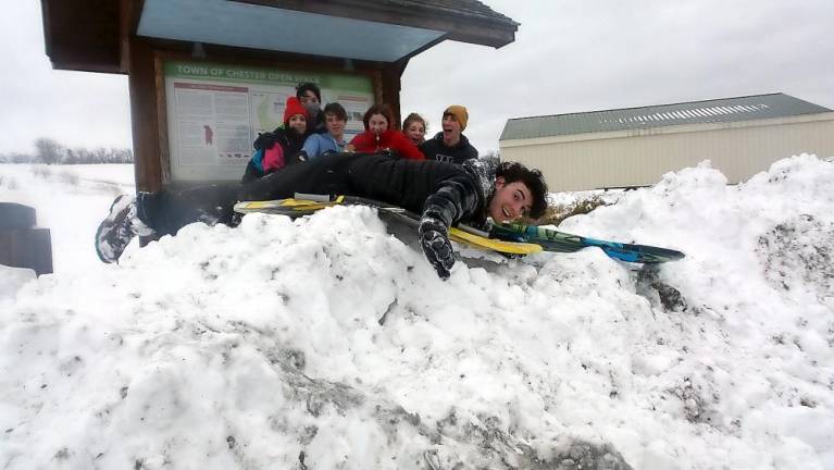 These teens spent Wednesday afternoon sledding in the snow at Knapps View in Chester. Winter Storm Quiana dumped as much as three feet of snow on parts of Orange County and more snow could be on the way in the coming week. Photo by Frances Ruth Harris.