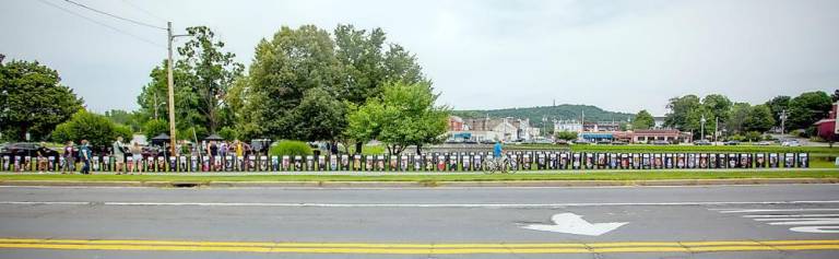 Black Posters with the faces of those who lost their lives from overdose lined the path of Monroe ponds and served as a chilling reminder of the overdose crisis.