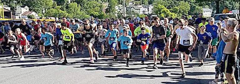 This is a scene from a previous 5k race sponsored by the Kiwanis Club of Chester. For its 26th edition of the race, the club has put in place safety measures for the volunteers and the participants. Provided photo.
