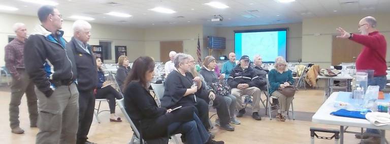 Jay Beaumont (right), chair of the Moodna Creek Water Shed Intermunicipal Council, talks to local residents at the Chester Senior/Recreation Center