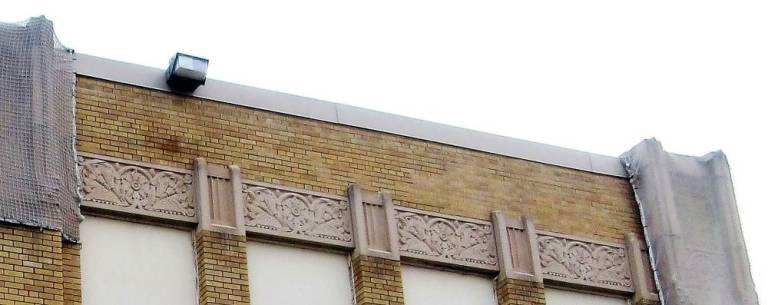 Floral relief bands near the roofline
