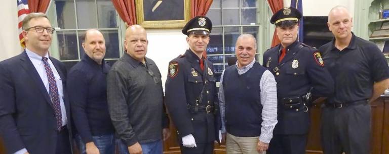 Investigator Michael Gregorio, a champion of vulnerable children, retires from village police department Inv. Michael Gregorio is congratulated by the police chief, mayor, and village board