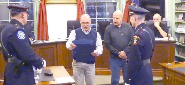 Investigator Michael Gregorio, a champion of vulnerable children, retires from village police department Mayor Michael Nuzzolese presents a certificate of appreciation to Inv. Michael Gregorio
