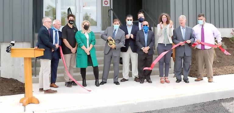 On Monday, Sept. 14, representatives of New York State, Orange County, the Town of Warwick and the Warwick Valley Chamber of Commerce joined Kaycha Labs owner Marco Pedone, his staff and associates to celebrate the grand opening of the facility with a ribbon cutting. Photo by Roger Gavan.