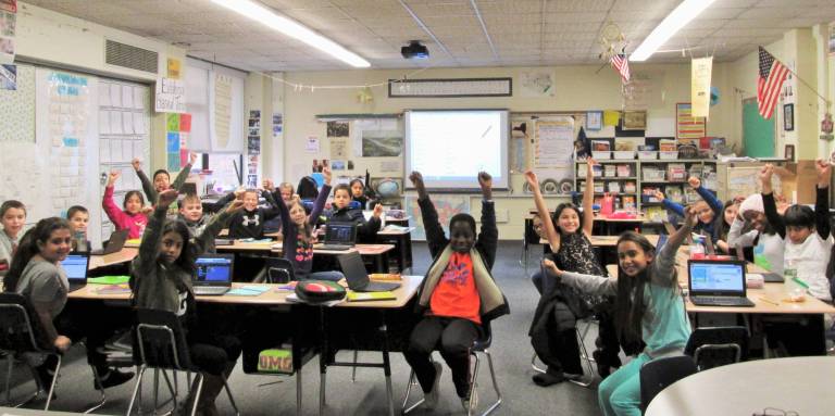 Coding is 'like playing,' young programers say Lots of enthusiasm for coding in Mr. Jeff Knight’s fourth-grade class (Photo by Ginny Privitar)