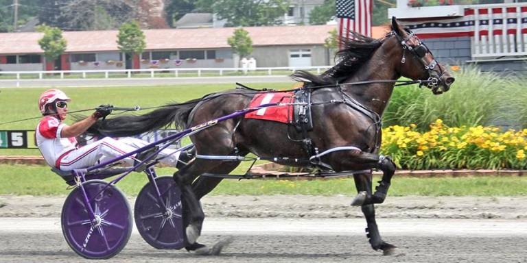 Goshen’s Jason Bartlett leading the field for one of his four victories on the opening day at Goshen Historic Track.