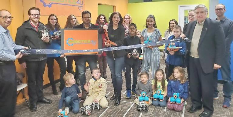 Monali Verma cuts the ribbon to celebrate a successful year at Robotics4U