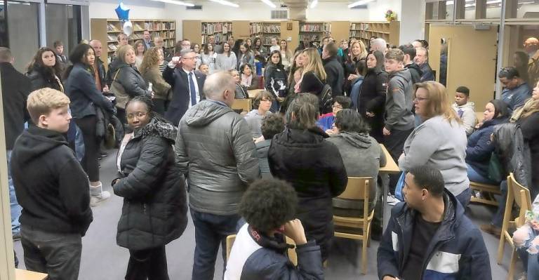 Accepted students to John S. Burke Catholic High School and their families gather in the school’s library for Accepted Students’ Night.