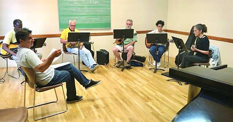 tuning up on the upper west side Paul Wolsk, in the yellow shirt, started playing saxophone in elementary school but gave it up shortly after college. He’s become a serious player again. He’s pictured in a jazz theory class taught by Roni Ben-Hur (left), the director of the adult division jazz program at the Lucy Moses School. Photo: Christina Cardona
