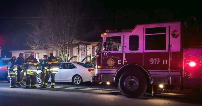 Firefighters from the Chester Fire Department responded to a flooded basement and hazardous condition at a home along Moffatt Lane on Christmas. Fire departments throughout Orange County were busy pumping out basements during the holiday. Photo by Robert G. Breese.