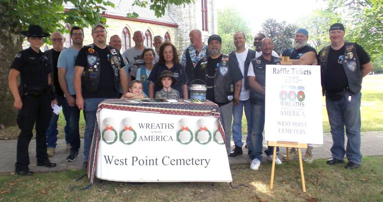 Blue Knights follow the patriots' path on 240th anniversary of battle In the center of the photo, taken in Goshen, N.Y., is Jackie McNally, a volunteer at the West Point Cemetery. (Photo by Frances Ruth Harris)