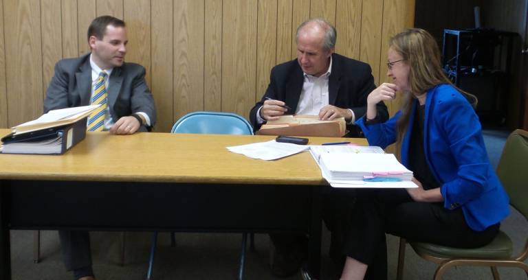 Village says BT Holdings can start building, but developer isn't happy The village team (from left): Ian Schlanger, the village's solicitor; attorney Dennis Lynch,representing the village against BT Holdings; and Kristen O'Donnell, the village's planner (Photo by Frances Ruth Harris)