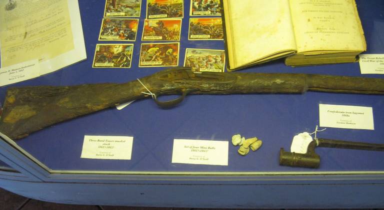 Union and disunion Musket and mini-balls on display at the Erie Station Museum.