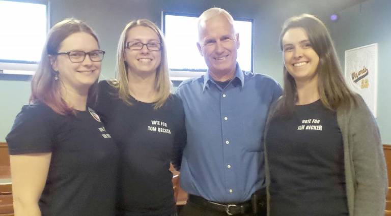 Tom Becker, the first Democrat to be elected to the town board since 2011, at GW's American Burgers Tuesday night with his daughters, Amy Becker, Kara Batewell, and Amber DiMontova.