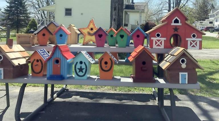 This is an assortment of the bird houses created by Micheal Kaleita. Take note of his use of old license plates for roofs. Photo By Jacob L. Mott.