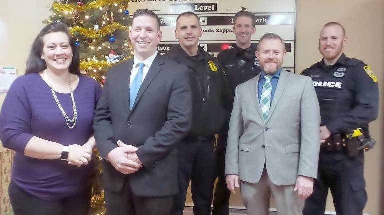 From left: Christine Dugan; Joshua Dugan, who was appointed a Town of Chester police sergeant at the town's Dec. 11 meeting; sergeant David Slowik; police chief Dan Doellinger,and officers Chambers and Dunlop.