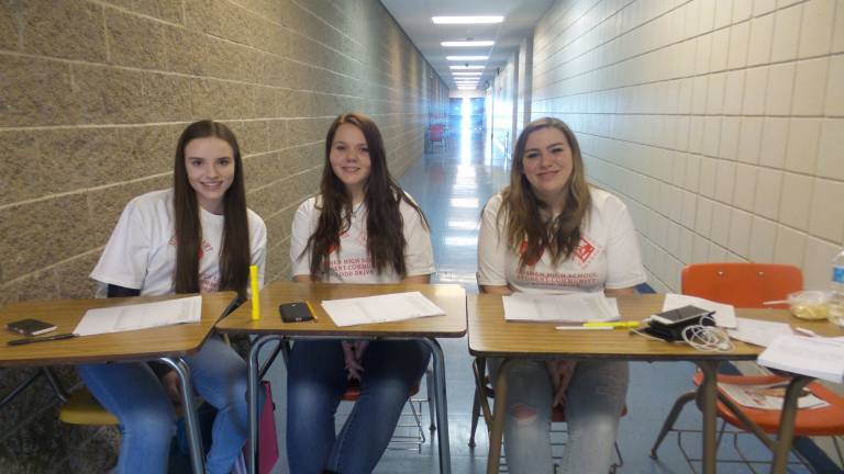 Hundreds give at Goshen blood drive Student check-in, Trish Ferguson, Brook Kerstanski and Kaylee Krauss (Photo by Frances Ruth Harris)