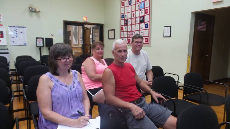 15 months later, controversial business continues to operate without site plan Residents Cindy and Tom Becker (in front) and Mary and Craig Braun at the Aug. 15 planning board meeting (Photo by Frances Ruth Harris)