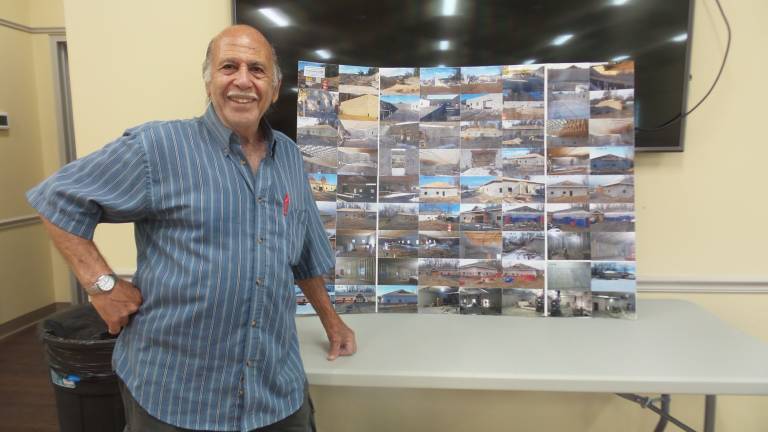 Chester celebrates brand-new senior center Patrick Arnone, pictured, with pictures he’s taken pictures of the senior center from the very beginning of construction. Supervisor Alex Jamieson said the sequence of pictures will be framed and hung in the new center. (Photo by Frances Ruth Harris)