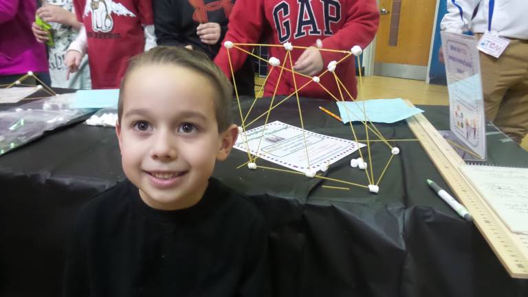 A fun night for science and math Jake Donolrio created a structure from marshmallows and strands of uncooked spaghetti.