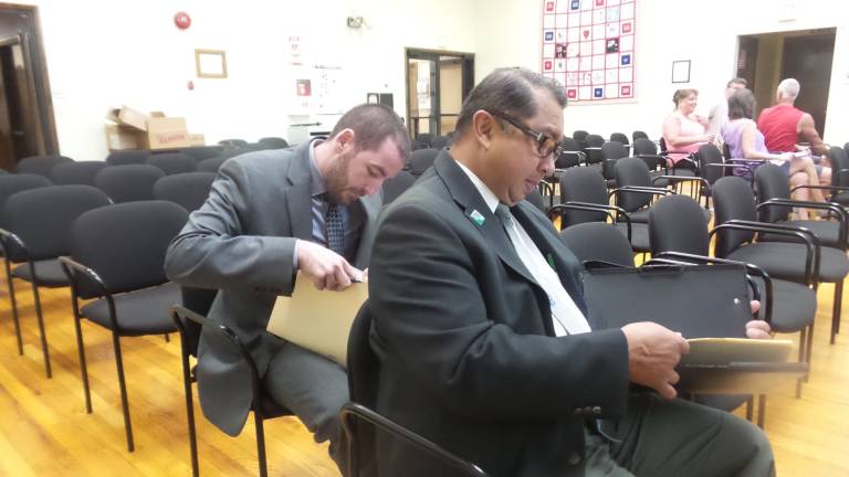 15 months later, controversial business continues to operate without site plan In front is Amador C. Laput, project manager for Fellenzer Engineering LLP, at the Aug. 15 planning board meeting. (Photo by Frances Ruth Harris)