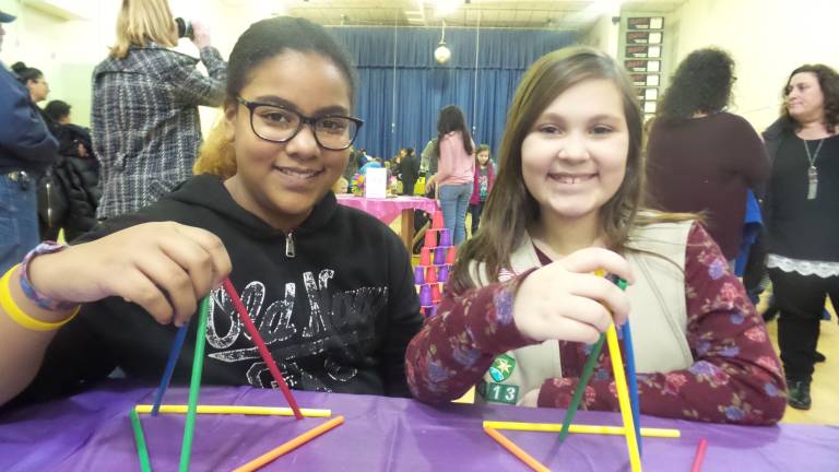 A fun night for science and math Triangle Challenge: Amber Jimenez and Olivia Katt create equivalent triangles using only six straws