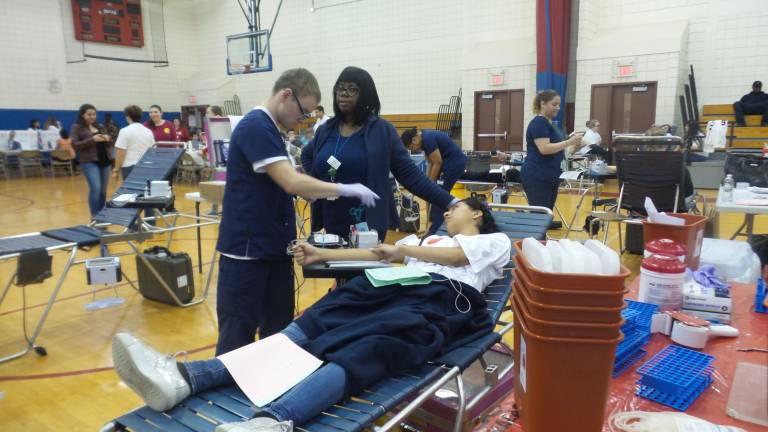 Hundreds give at Goshen blood drive David Muckell, June South-Anthony, and Angelica Cruz (Photo by Frances Ruth Harris)