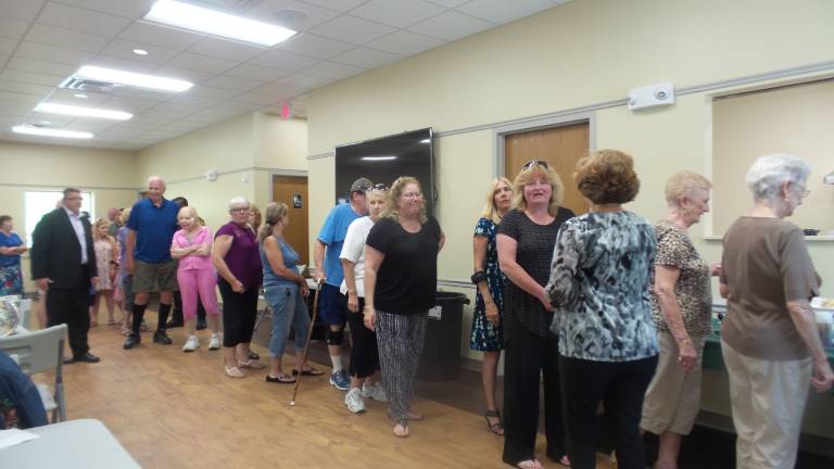 Chester celebrates brand-new senior center Guests lilne up for refreshments on opening day (Photo by Frances Ruth Harris)